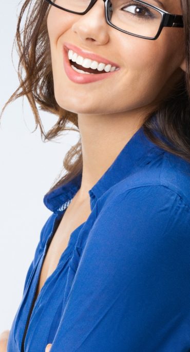 Happy young businesswoman in glasses